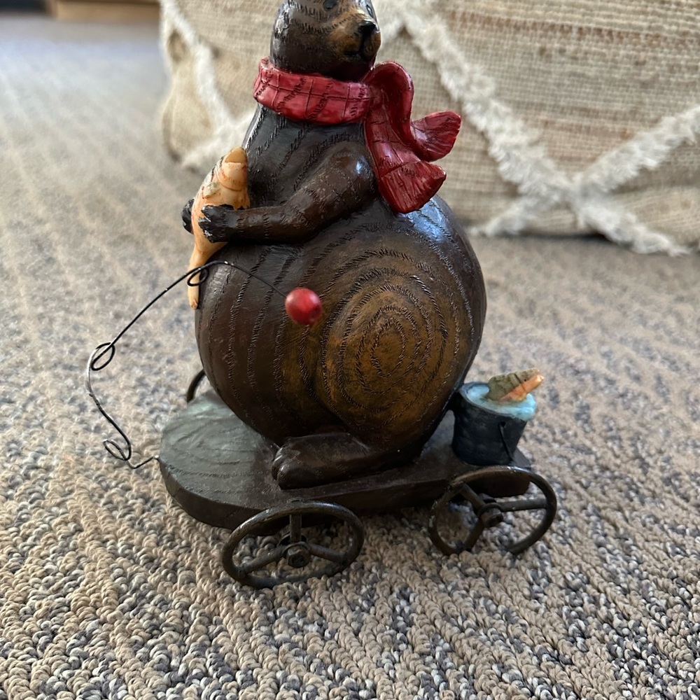Unbranded wooden chubby bear holding fish on wonky wheeled wagon